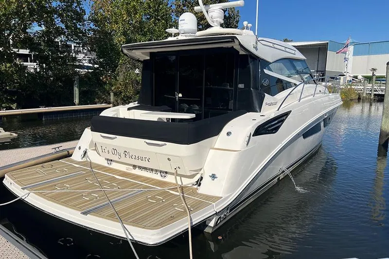 Slide: The Image of 2015 Sea Ray 470 Sundancer yacht docked in marina, rear view. - 3