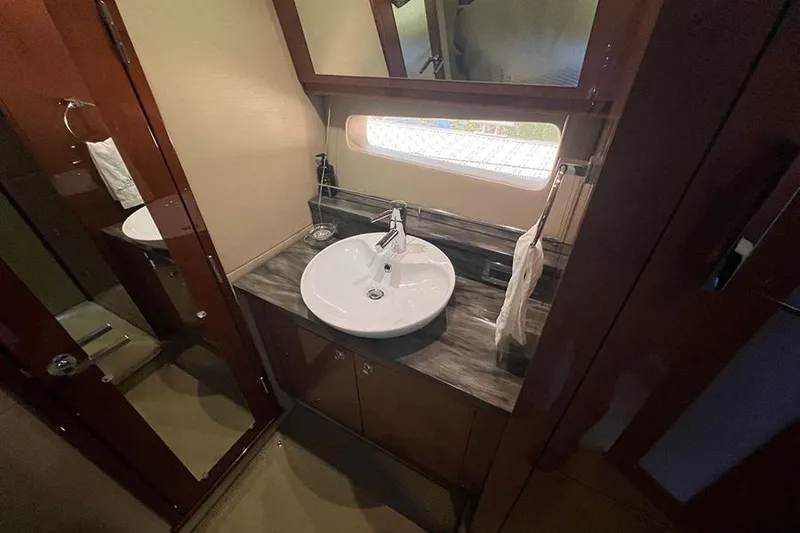 Slide: The Image of Luxurious bathroom in 2015 Sea Ray 470 Sundancer yacht with modern sink and mirror. - 30