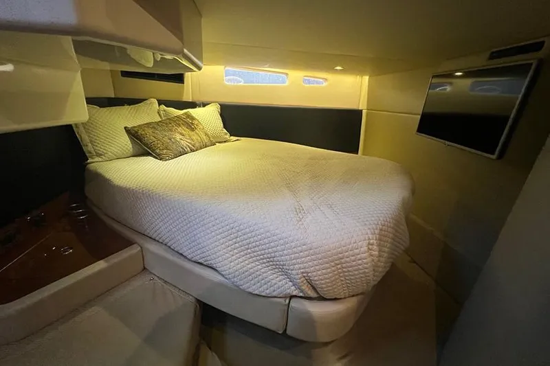 Slide: The Image of Luxurious bedroom interior of 2015 Sea Ray 470 Sundancer yacht with cozy bed and TV. - 32