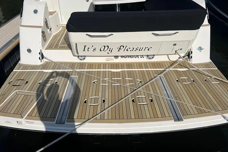 Slide: The Image of 2015 Sea Ray 470 Sundancer boat deck with "It's My Pleasure" nameplate. - 4