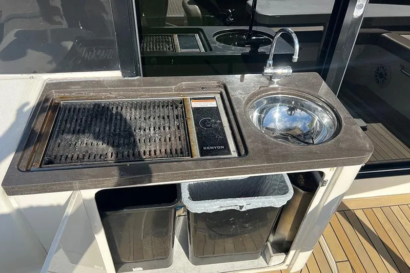 Slide: The Image of Outdoor kitchen on 2015 Sea Ray 470 Sundancer yacht with grill and sink. - 6