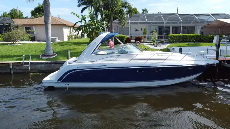 The Image of 2003 Formula 37PC boat docked near waterfront homes. - 0