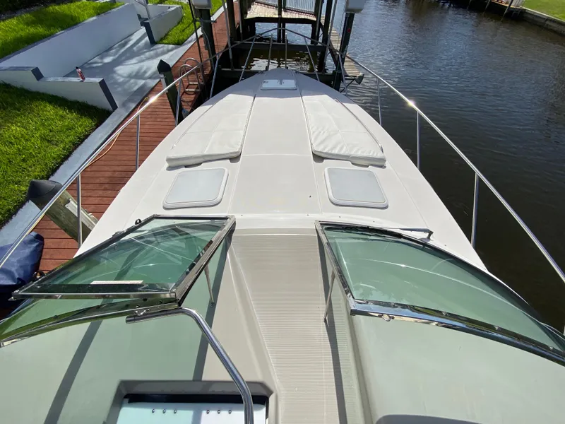 Slide: The Image of 2003 Formula 37PC yacht bow view with sunpads and docked at marina. - 10