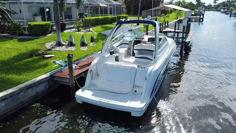 Slide: The Image of 2003 Formula 37PC boat docked by a waterfront home. - 11
