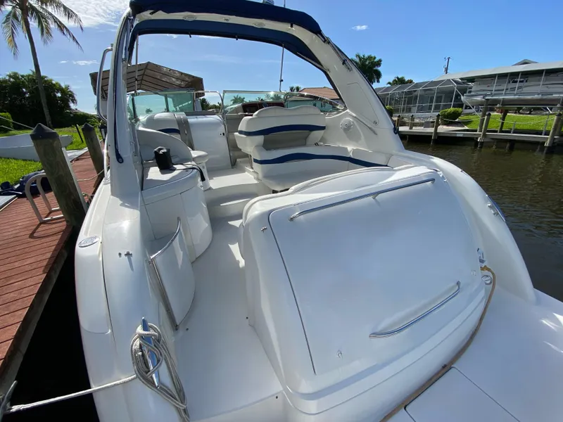 Slide: The Image of 2003 Formula 37PC yacht docked, featuring spacious seating and sleek design. - 12