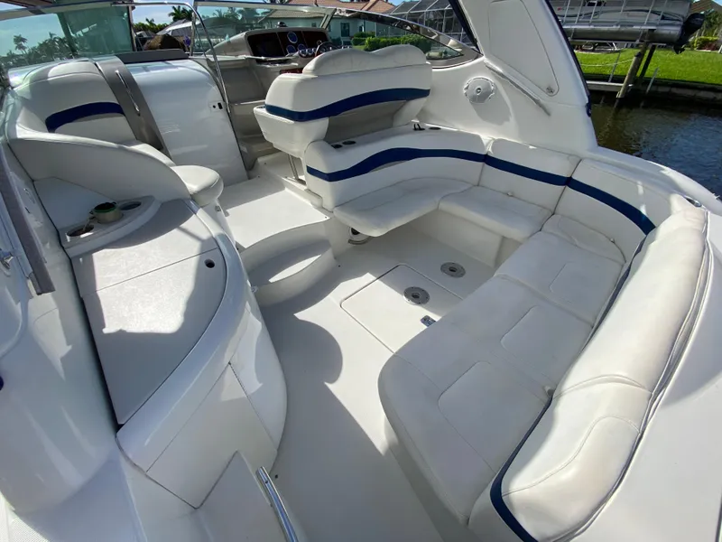 Slide: The Image of 2003 Formula 37PC boat interior with white and blue seating. - 13