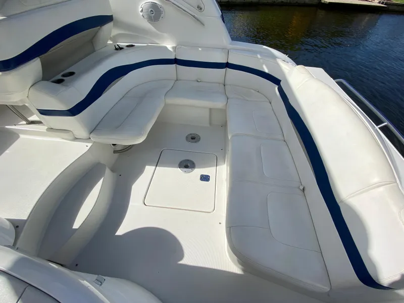 Slide: The Image of 2003 Formula 37PC boat with white and blue seating area. - 14