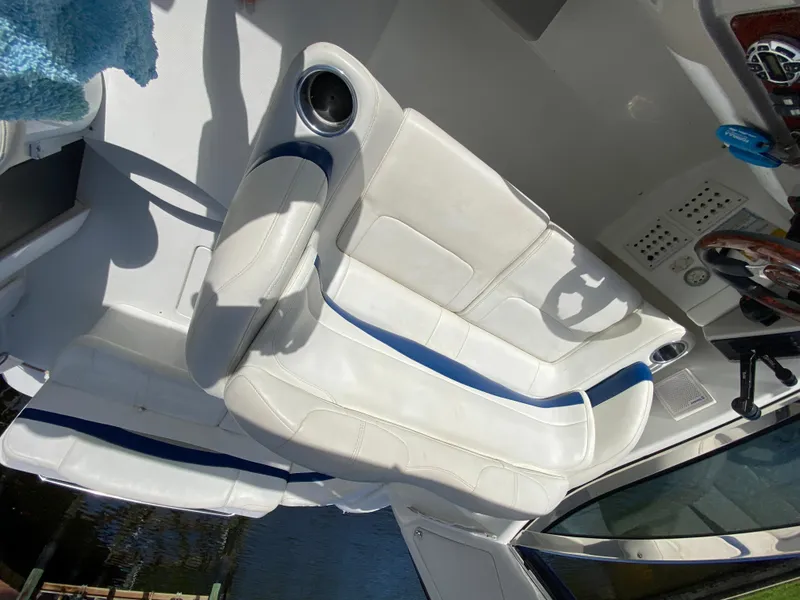Slide: The Image of 2003 Formula 37PC boat interior with white and blue seating. - 16