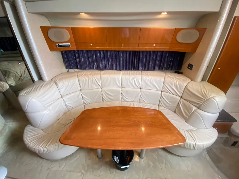 Slide: The Image of 2003 Formula 37PC yacht interior with leather seating and wooden table. - 23