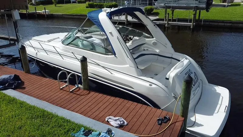 Slide: The Image of 2003 Formula 37PC boat docked by a wooden pier. - 29