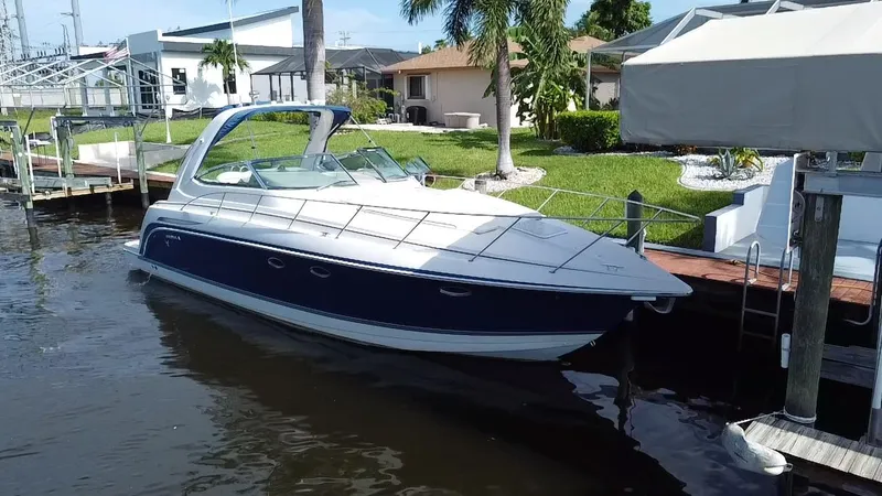 Slide: The Image of 2003 Formula 37PC boat docked near waterfront homes. - 3