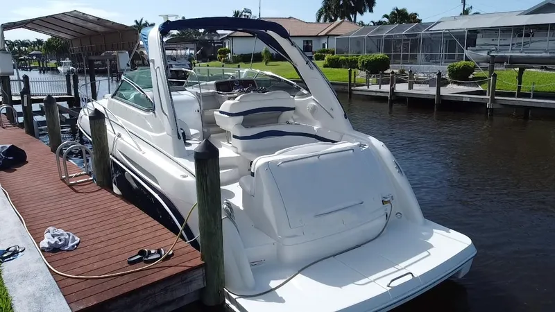 Slide: The Image of 2003 Formula 37PC yacht docked at a marina. - 30