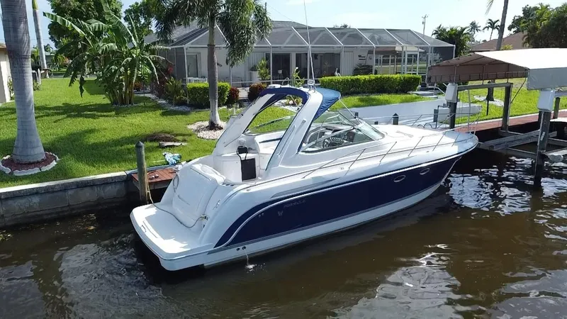Slide: The Image of 2003 Formula 37PC boat docked by a waterfront home. - 32