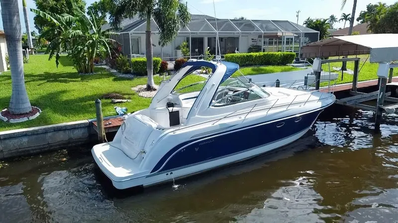 Slide: The Image of 2003 Formula 37PC boat docked near a waterfront home. - 4