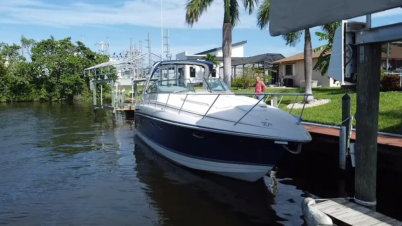 Slide: The Image of 2003 Formula 37PC boat docked by a waterfront home. - 5