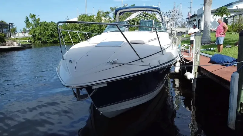 Slide: The Image of 2003 Formula 37PC yacht docked at a marina. - 6