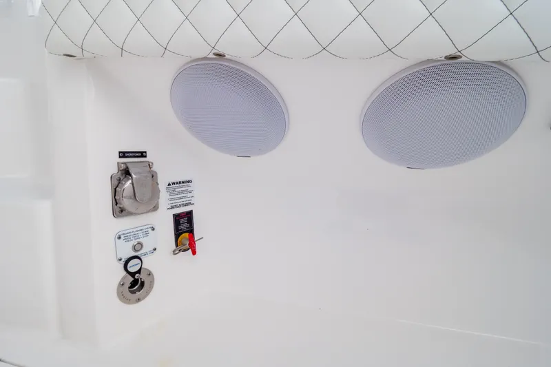 Slide: The Image of 2023 Intrepid 345 Valor boat interior with speakers and control panel. - 100