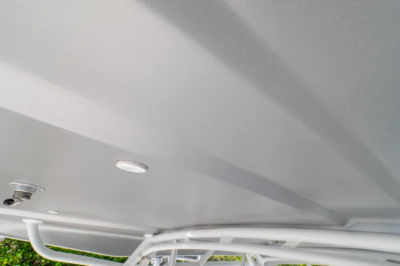 Slide: The Image of Ceiling view of 2023 Intrepid 345 Valor boat with lighting and structural details. - 123