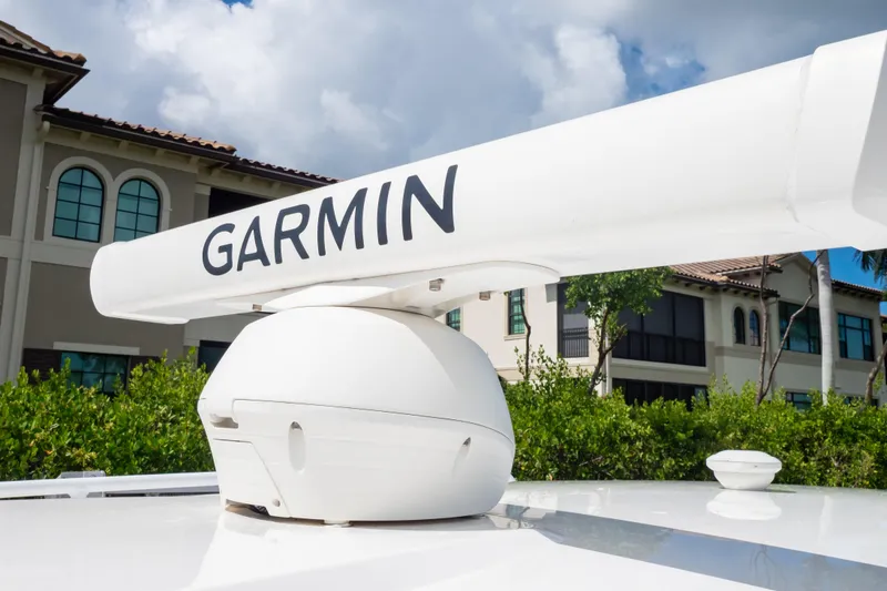 Slide: The Image of Garmin radar on 2023 Intrepid 345 Valor boat, with residential background. - 125