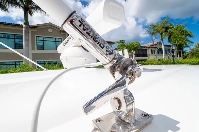 Slide: The Image of Close-up of 2023 Intrepid 345 Valor boat antenna with buildings in background. - 126