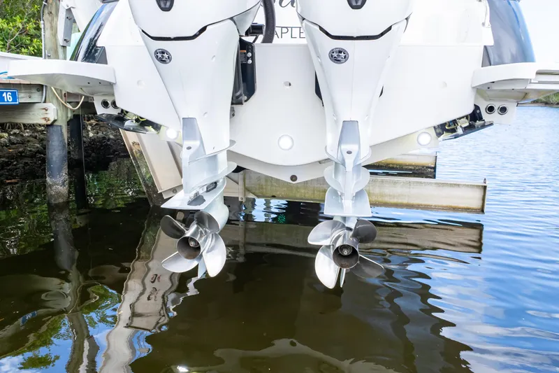 Slide: The Image of 2023 Intrepid 345 Valor boat engines and propellers above water. - 22