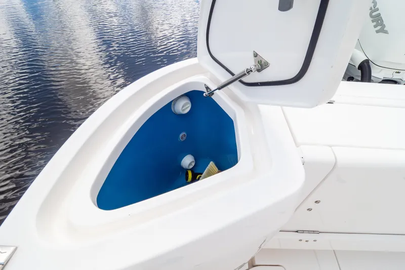 Slide: The Image of 2023 Intrepid 345 Valor boat storage compartment open, showing interior details. - 27