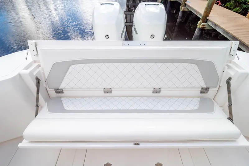 Slide: The Image of 2023 Intrepid 345 Valor boat with cushioned seating and dual outboard motors. - 30