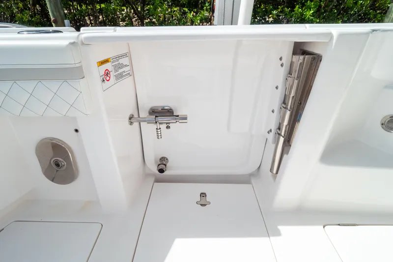 Slide: The Image of 2023 Intrepid 345 Valor boat interior with stainless steel fixtures and white finish. - 33