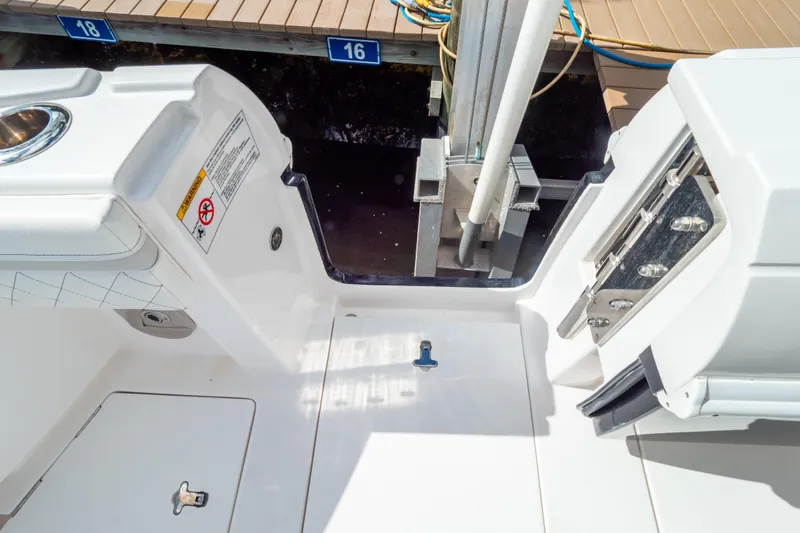 Slide: The Image of 2023 Intrepid 345 Valor boat deck with dock view and safety features. - 36