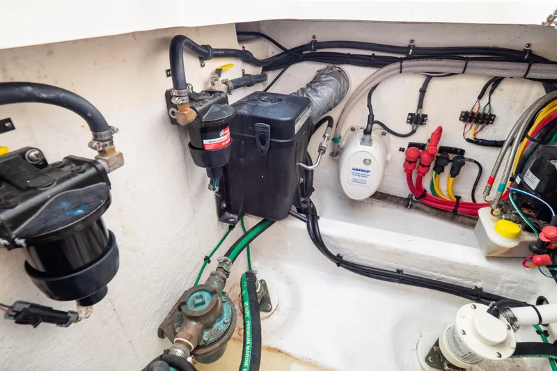 Slide: The Image of Engine compartment of 2023 Intrepid 345 Valor, showcasing wiring and mechanical components. - 42