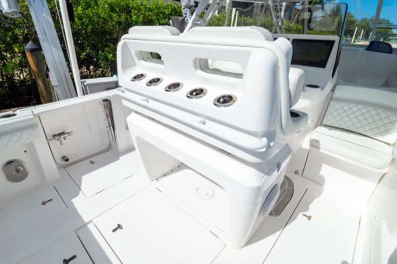Slide: The Image of 2023 Intrepid 345 Valor boat interior with sleek white seating and modern design. - 49