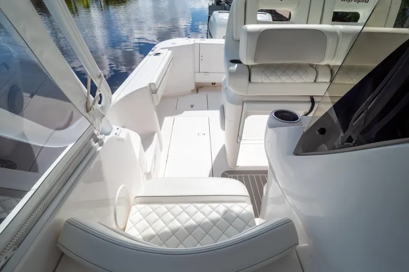 Slide: The Image of 2023 Intrepid 345 Valor boat interior with white seating and sleek design. - 57