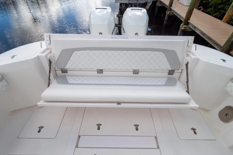 Slide: The Image of 2023 Intrepid 345 Valor boat with open rear seating and dual engines. - 6