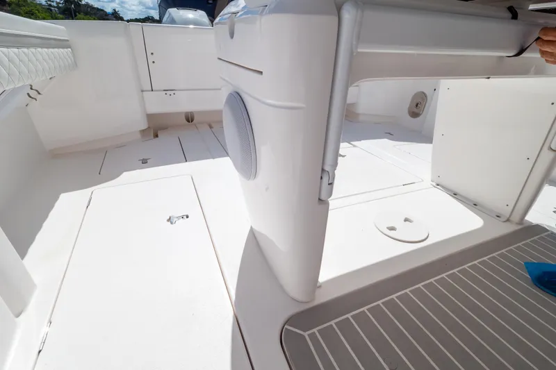 Slide: The Image of 2023 Intrepid 345 Valor boat interior with sleek white design and spacious layout. - 63