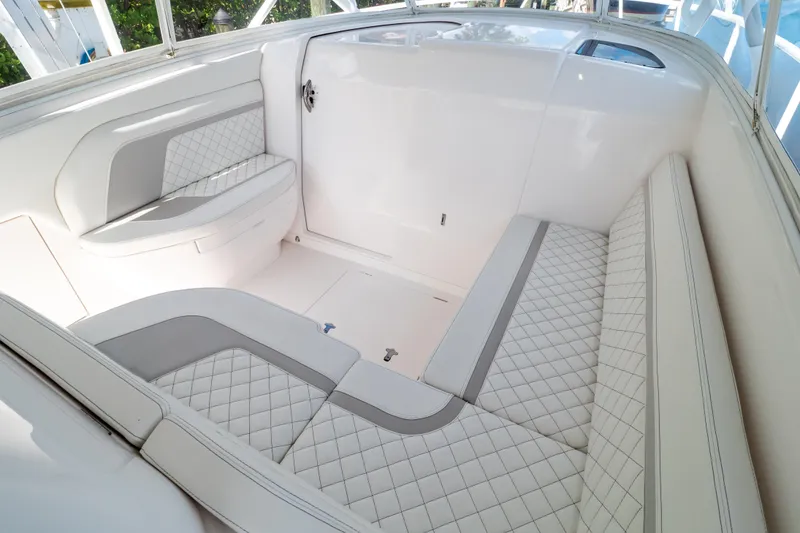 Slide: The Image of 2023 Intrepid 345 Valor boat interior with luxurious white quilted seating. - 66