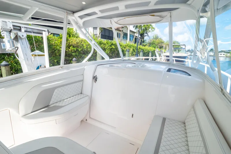 Slide: The Image of 2023 Intrepid 345 Valor boat interior with white seating and modern design. - 67