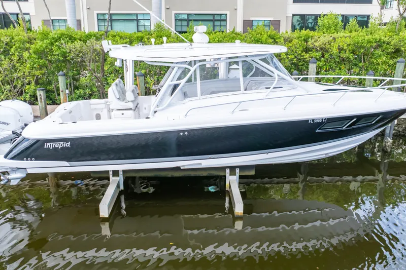 Slide: The Image of 2023 Intrepid 345 Valor boat docked, featuring sleek design and modern amenities. - 71