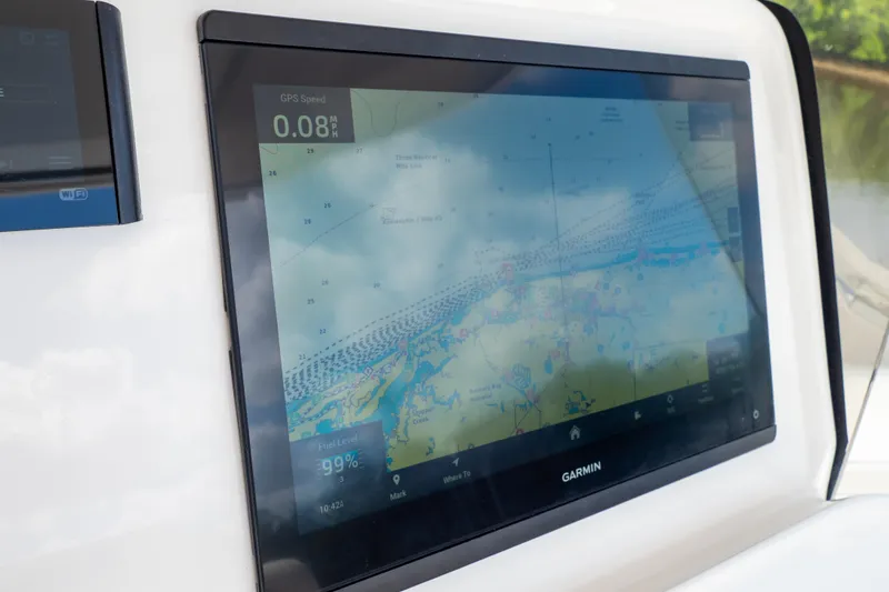 Slide: The Image of Garmin navigation display on 2023 Intrepid 345 Valor boat, showing GPS speed and map. - 73