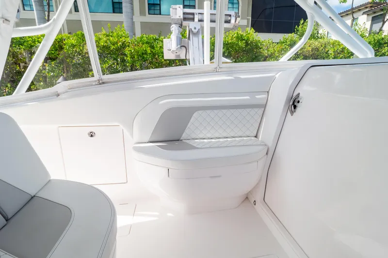 Slide: The Image of 2023 Intrepid 345 Valor boat interior with white seating and sleek design. - 91