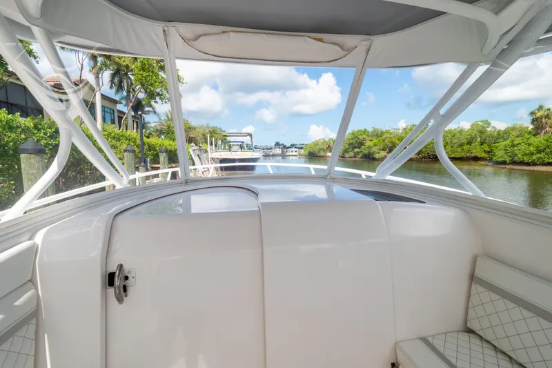 Slide: The Image of 2023 Intrepid 345 Valor boat interior with scenic waterway view. - 92