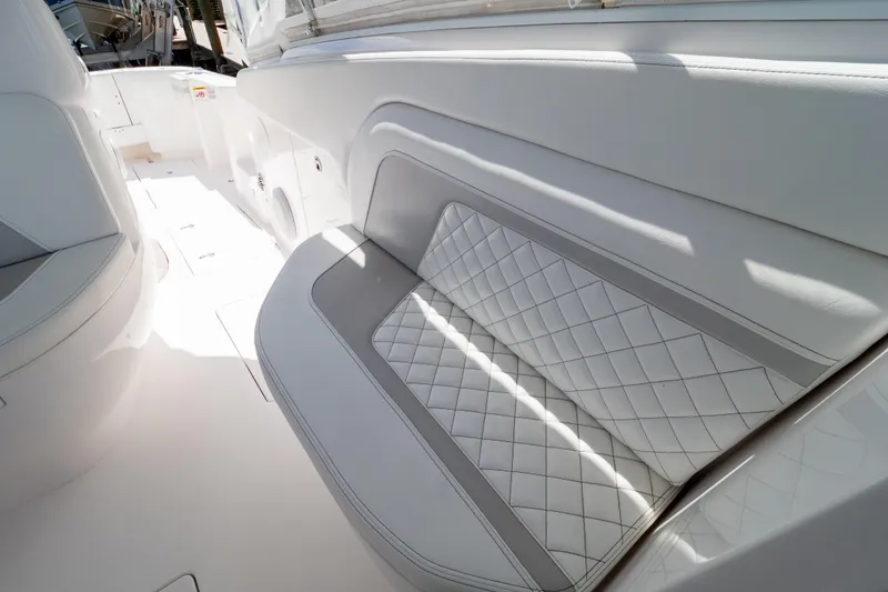 Slide: The Image of Luxurious seating on 2023 Intrepid 345 Valor boat, featuring elegant white upholstery. - 96