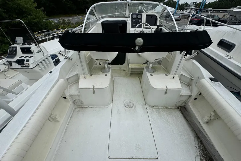Slide: The Image of 2000 Hydra-Sports 212 Seahorse WA boat interior with dual seats and steering console. - 5
