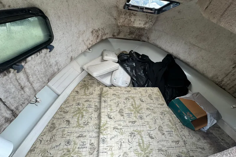 Slide: The Image of Interior cabin of 2000 Hydra-Sports 212 Seahorse WA with cushions and storage items. - 8