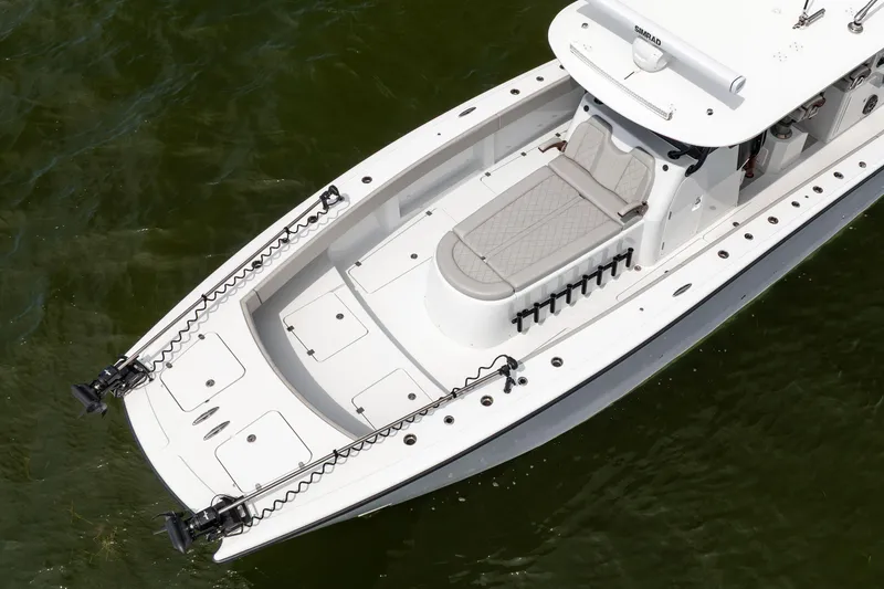 Slide: The Image of 2025 Freeman 42 LR boat on water, featuring spacious deck and modern design. - 11