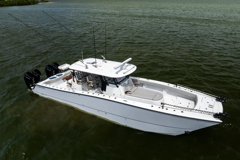 Slide: The Image of 2025 Freeman 42 LR boat on water, featuring sleek design and multiple outboard engines. - 16