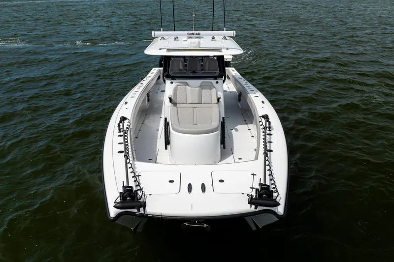 Slide: The Image of 2025 Freeman 42 LR boat on water, aerial view, sleek design. - 17