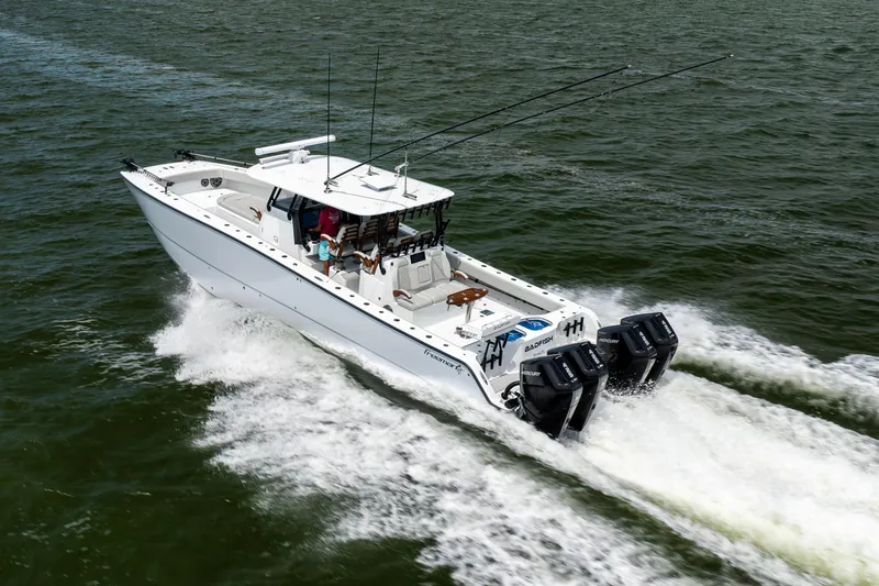 Slide: The Image of 2025 Freeman 42 LR boat cruising on open water with powerful engines. - 20