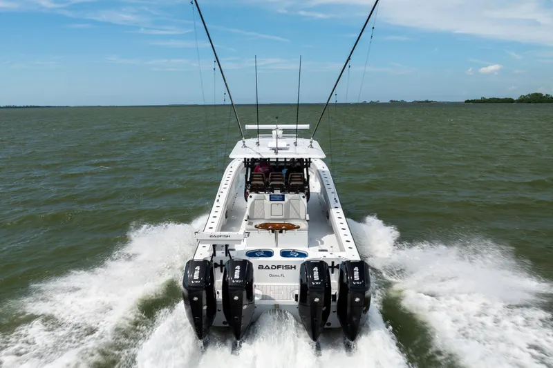 Slide: The Image of Freeman 42 LR 2025 boat cruising on open water with four engines. - 22