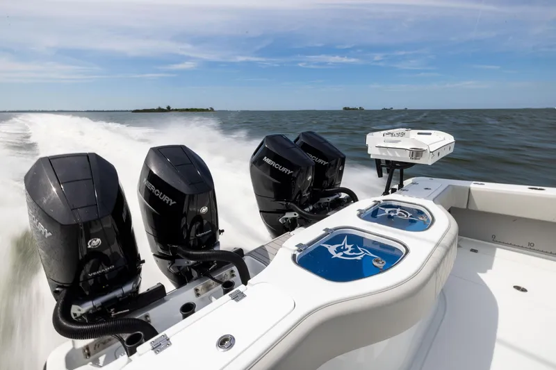 Slide: The Image of Freeman 42 LR 2025 boat with powerful Mercury engines cruising on open water. - 23