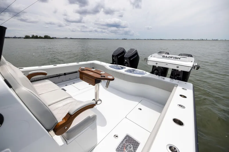 Slide: The Image of Freeman 42 LR 2025 boat with dual engines on a calm sea. - 26